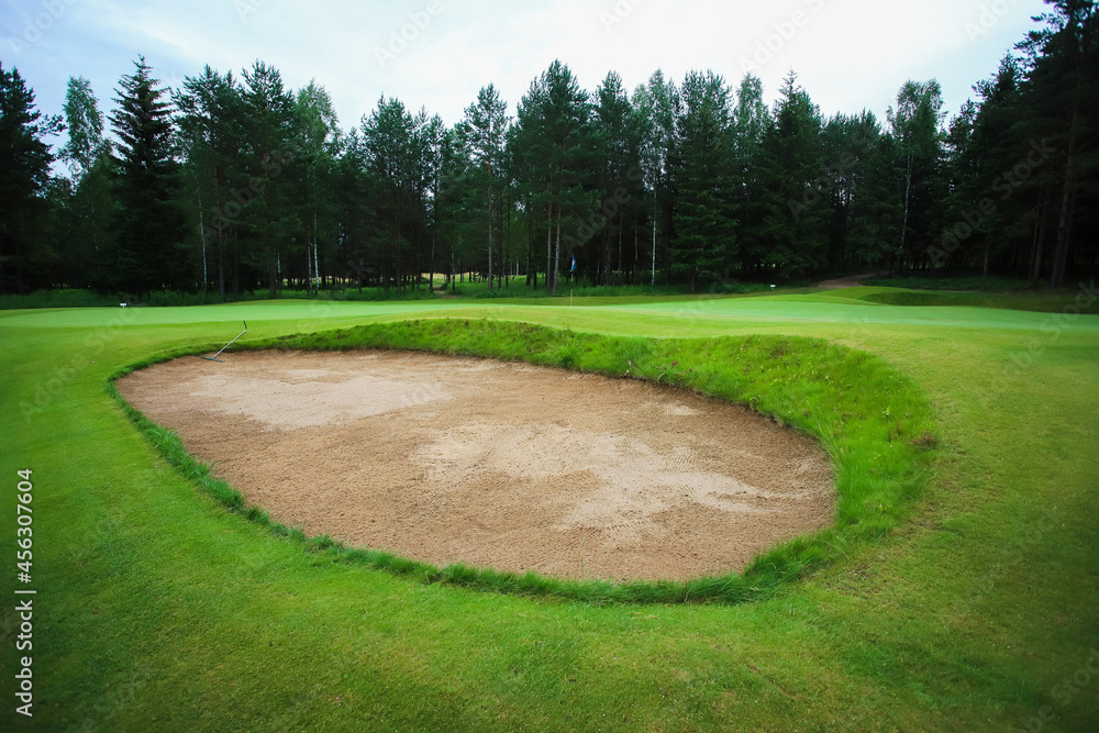 Golf course in the middle of the forest glade. Golf course in the middle of the forest glade.