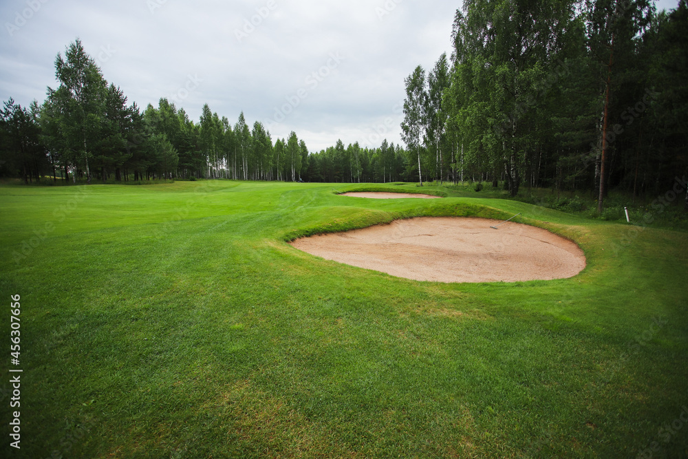 Golf course in the middle of the forest glade. Golf course in the middle of the forest glade.