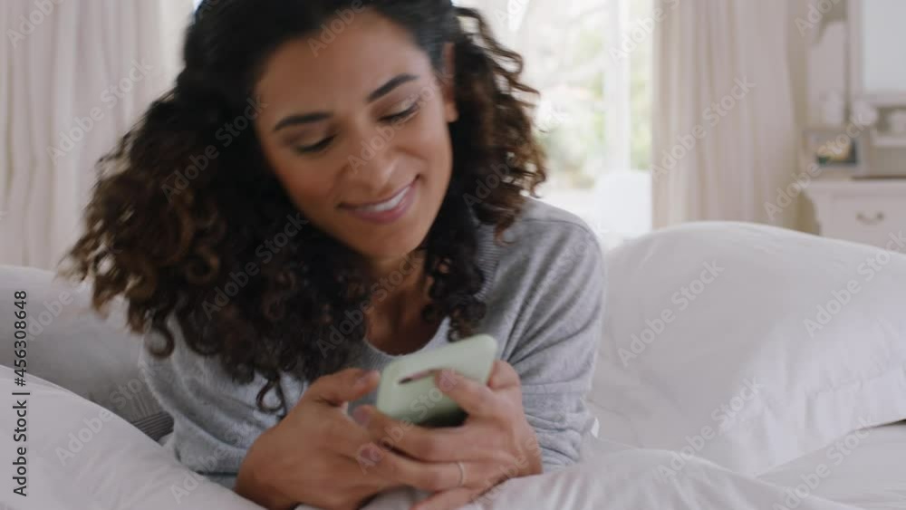 young beautiful woman using smartphone texting browsing social media messages enjoying mobile phone communication lying on bed at home 4k footage young beautiful woman using smartphone texting browsing social media messages enjoying mobile phone communication lying on bed at home 4k footage