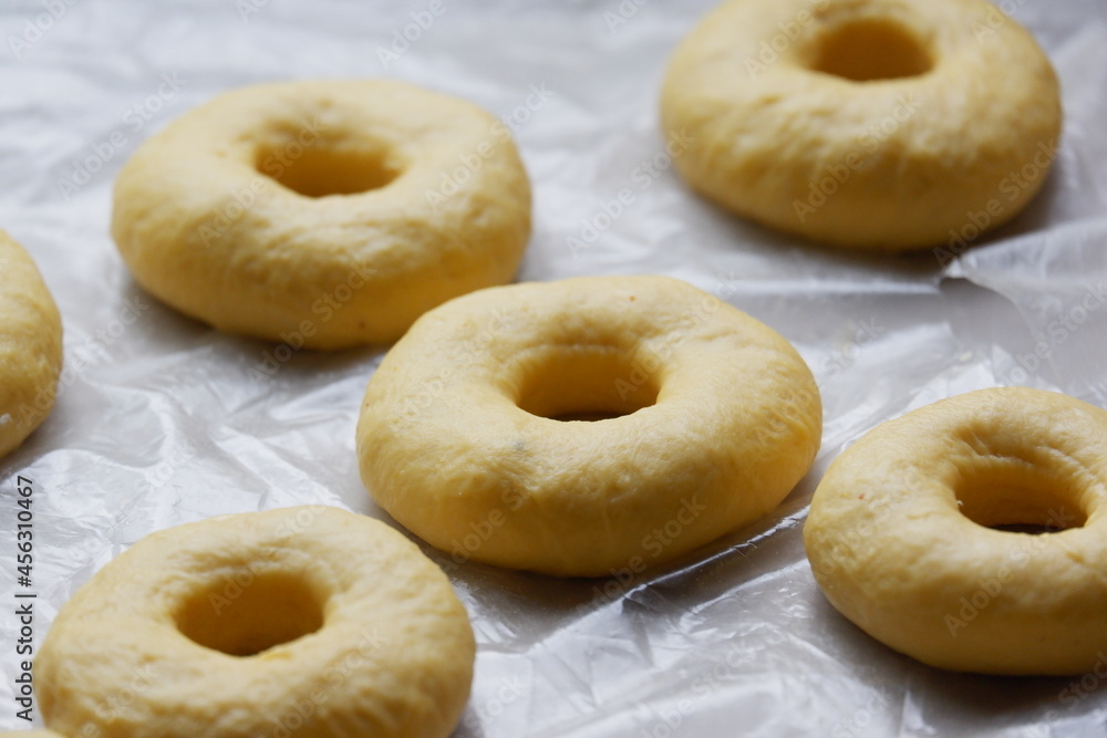 Cutting from fresh dough yummy and homemade donuts Cutting from fresh dough yummy and homemade donuts
