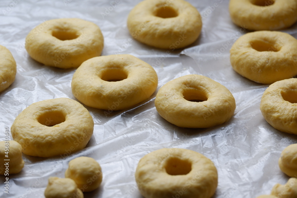 Cutting from fresh dough yummy and homemade donuts Cutting from fresh dough yummy and homemade donuts