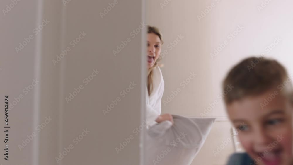 happy mother and son playing catch running through house mom playing game having pillow fight with little boy enjoying fun weekend together 4k footage happy mother and son playing catch running through house mom playing game having pillow fight with little boy enjoying fun weekend together 4k footage