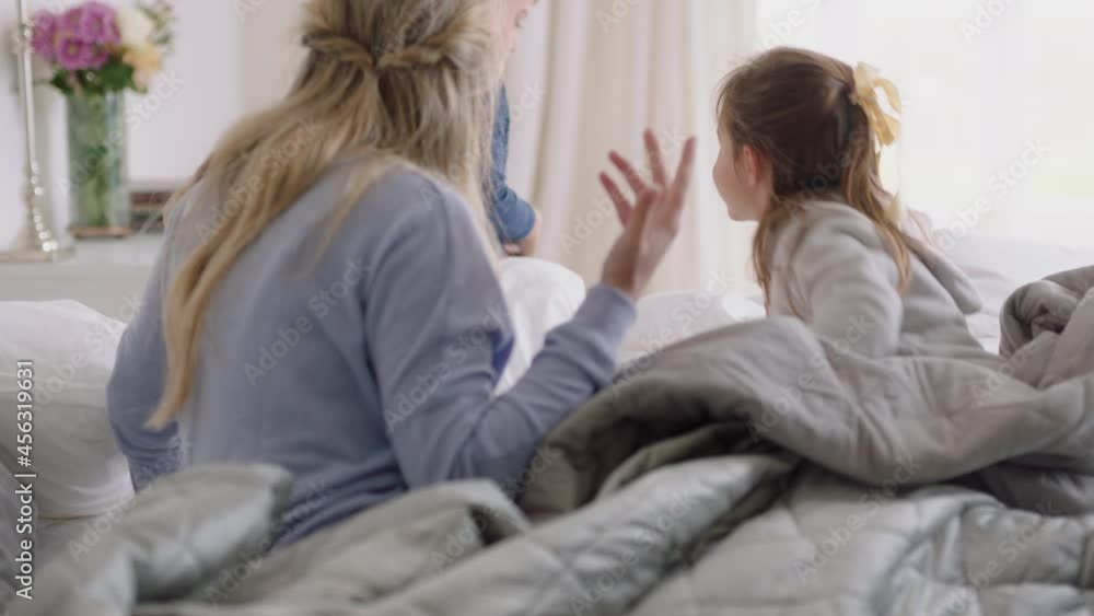 happy family with children jumping on bed playing with mother and father having fun on weekend morning excited little kids enjoying game with parents at home 4k footage happy family with children jumping on bed playing with mother and father having fun on weekend morning excited little kids enjoying game with parents at home 4k footage