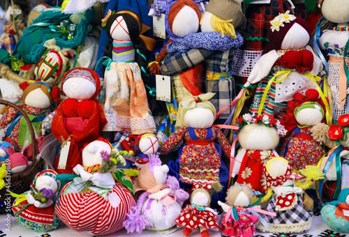 Close photo of Ukrainian folk amulet dolls `motankas` of knotted straw and fabric © Alex