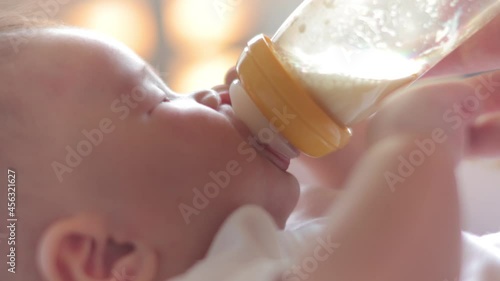 Baby drinking a bottle of milk