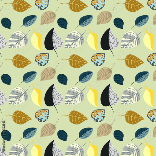 Blue, yellow, beige and gray leaves are collected in a pattern on a light green background.