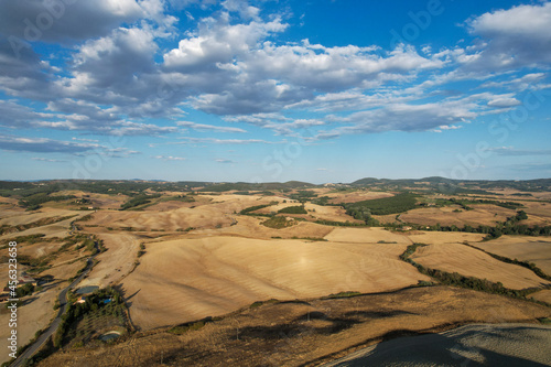  Beautiful idyllic late summer landscape of Toscana with photographed with drone. Sunny day in Italy. Vacation, recreation mood. Agricultural fields of Tuscany 