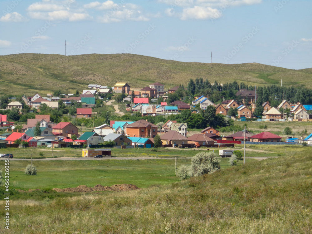Obraz premium One of the districts of the city of Ust-Kamenogorsk (kazakhstan). City outskirts. Cottages. Summer steppe