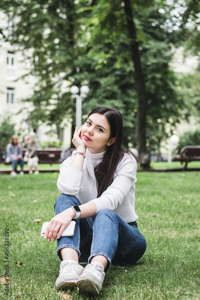 Stylish beautiful brunette girl in a summer city Stylish beautiful brunette girl in a summer city
