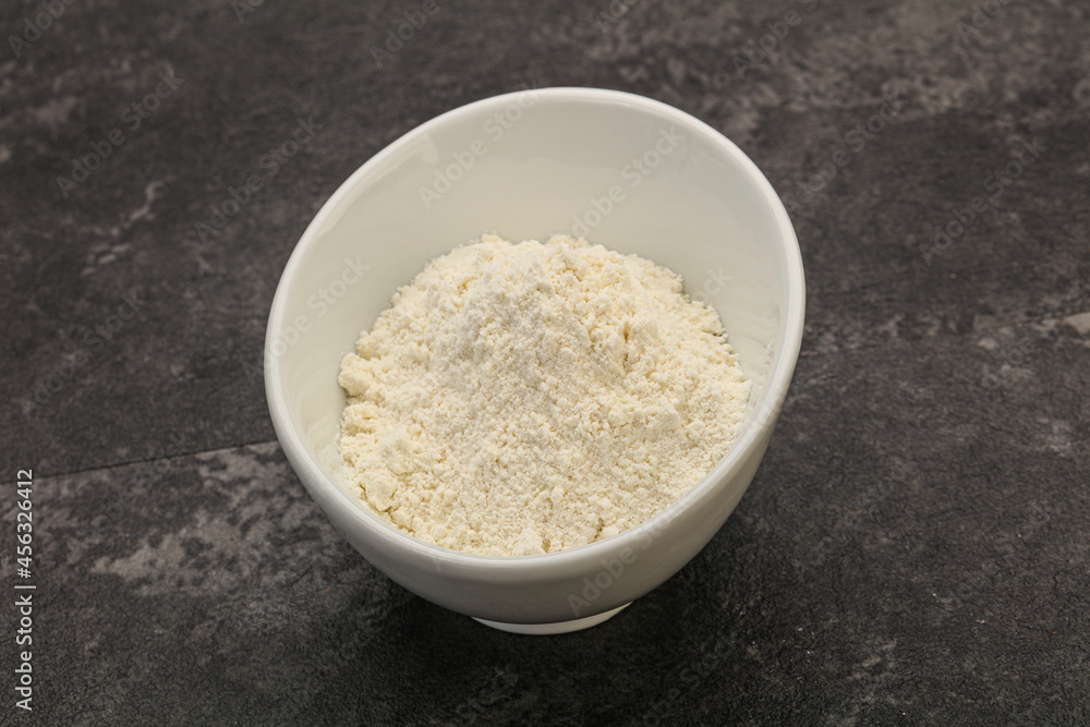 Wheat flour heap in the bowl