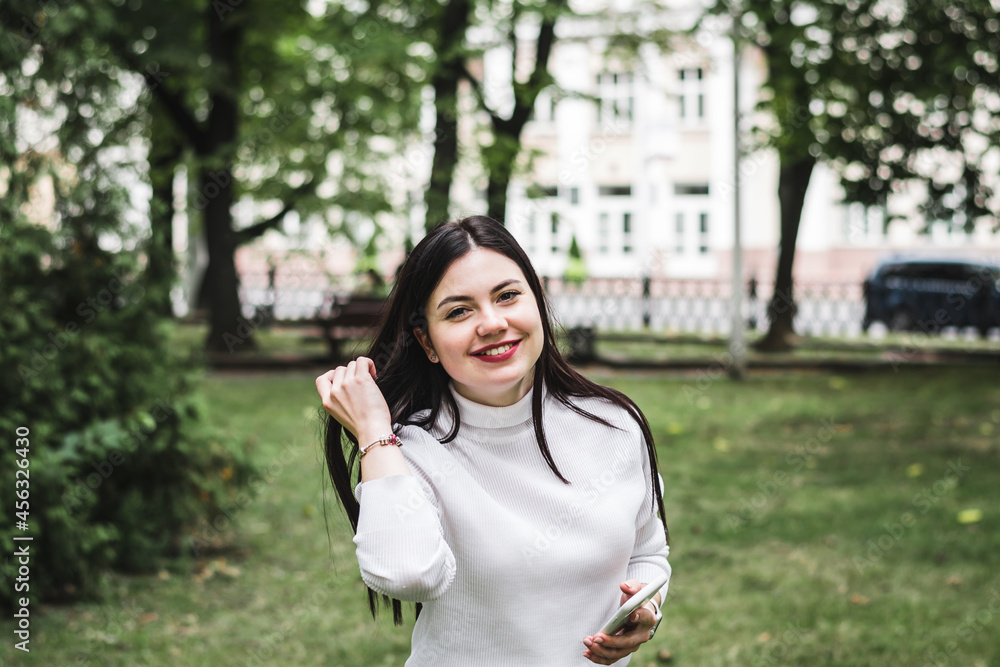 Stylish beautiful brunette girl in a summer city Stylish beautiful brunette girl in a summer city