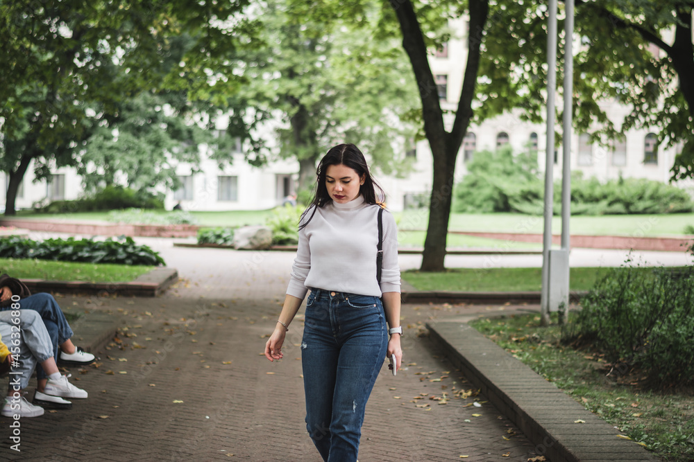 Stylish beautiful brunette girl in a summer city Stylish beautiful brunette girl in a summer city