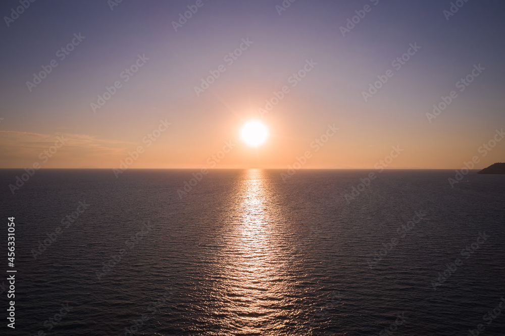 marine aerial view of the setting sun