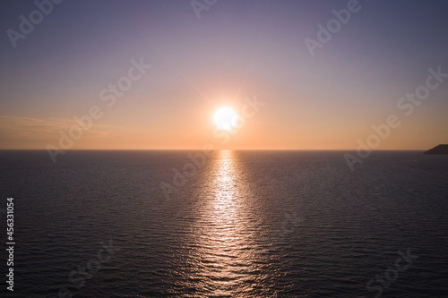 marine aerial view of the setting sun