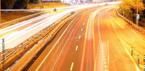 Tráfico nocturno en el la carretera M-607 en Madrid, España. Luces de los coches en movimiento tras una larga exposición desde el puente de Tres Olivos. photo