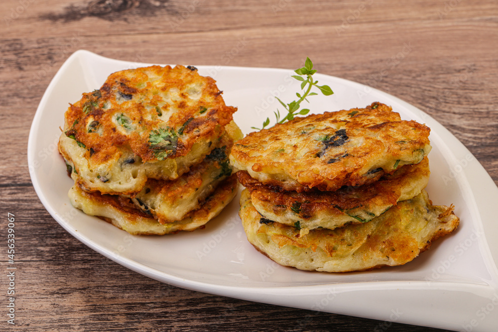Zucchini pancakes with herbs and spices Zucchini pancakes with herbs and spices