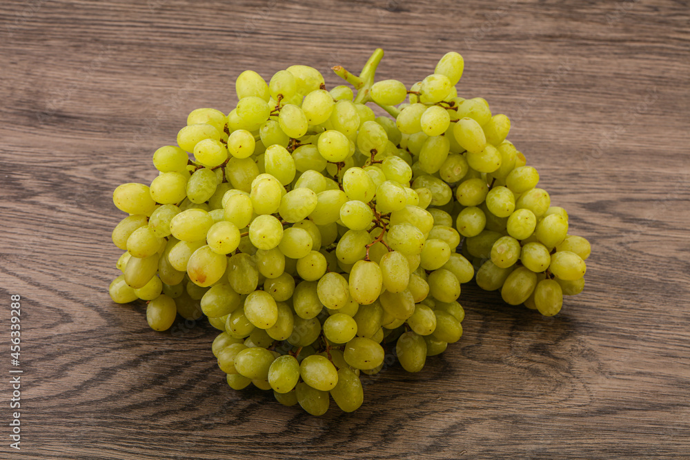 Green grape branch over background Green grape branch over background