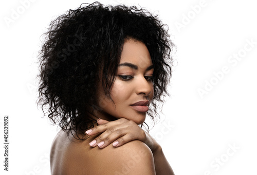 Young beautiful black woman with smooth skin on white background