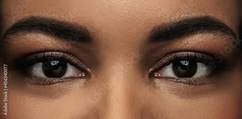 Black woman face with a beautiful brown eyes