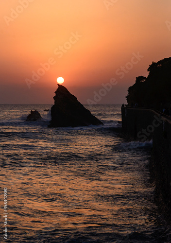 Magnificent sunset on the immersed rock of the Biarritz coast in the Basque Country