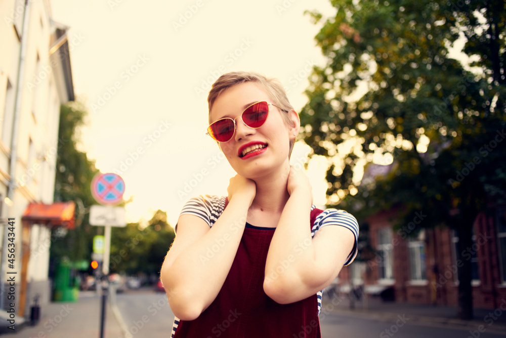 pretty woman wearing sunglasses outdoors lifestyle fashion posing