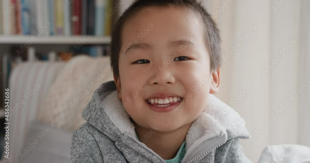portrait funny little asian boy smiling looking at camera with naughty happy playful expression enjoying childhood testimonial concept 4k footage portrait funny little asian boy smiling looking at camera with naughty happy playful expression enjoying childhood testimonial concept 4k footage