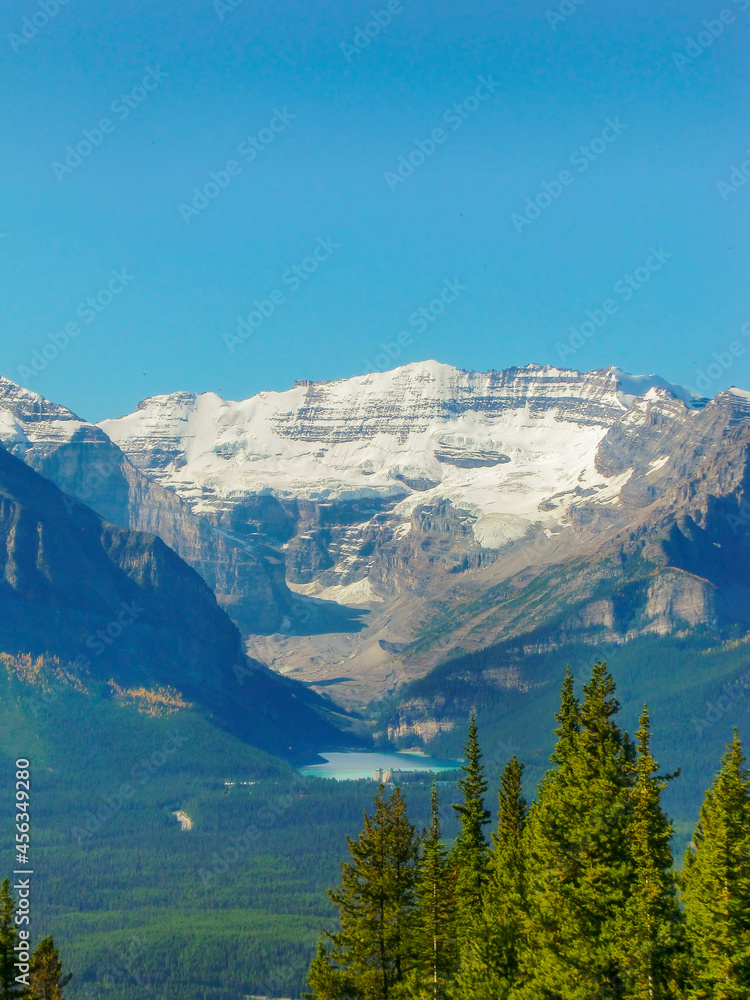 Canadian landscape with snow-capped mountains, blue lake and forest | Lake Louise, Canada