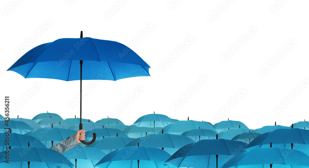 Person holding umbrella over other on white background