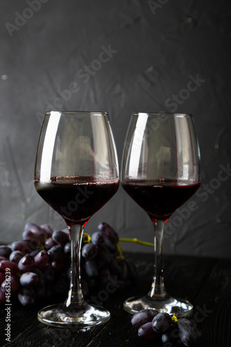 Red wine in a glass and grapes