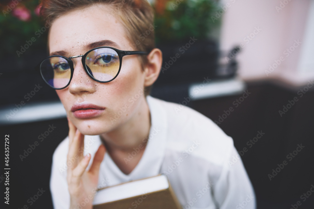 female with a book in his hands reading education female with a book in his hands reading education