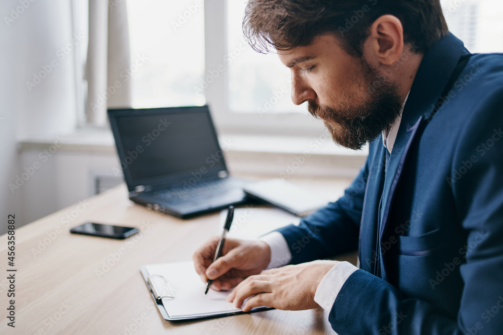 bearded man working for a laptop in the office emotions professional bearded man working for a laptop in the office emotions professional