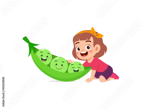cute little girl stands with pea character