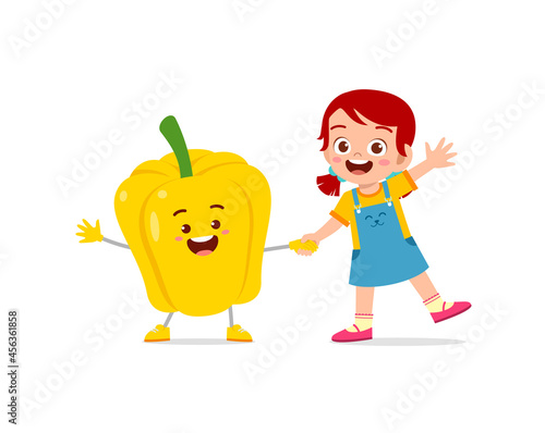 cute little girl stands with paprika character