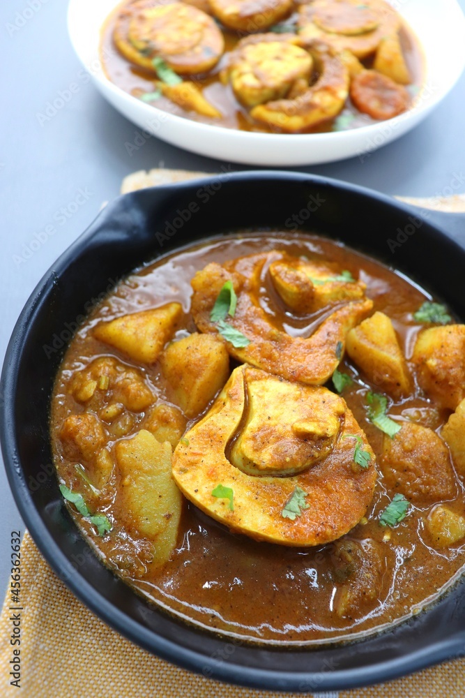 Indian non-vegetarian food Homemade Egg Curry or Anda masala gravy, baida curry. Indian spicy food. Perfect Indian lunch. over moody background with copy space. Indian non-vegetarian food Homemade Egg Curry or Anda masala gravy, baida curry. Indian spicy food. Perfect Indian lunch. over moody background with copy space.
