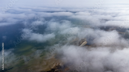 Fototapeta Naklejka Na Ścianę i Meble -  Aerial View from of the fog forest and the sea