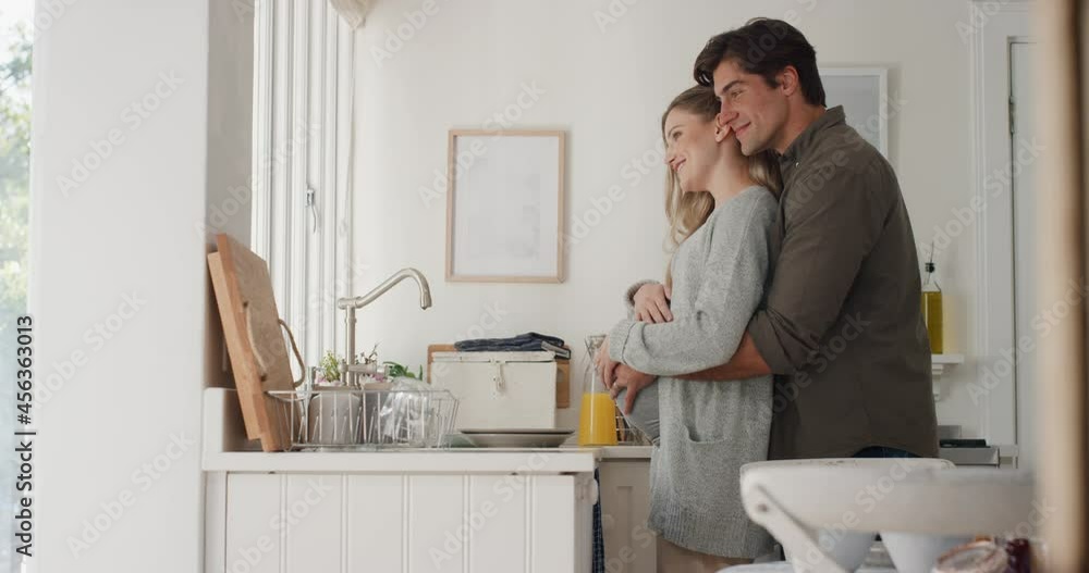 happy pregnant couple hugging proud husband embracing wife holding her belly excited for parenthood looking out window thinking of future 4k happy pregnant couple hugging proud husband embracing wife holding her belly excited for parenthood looking out window thinking of future 4k