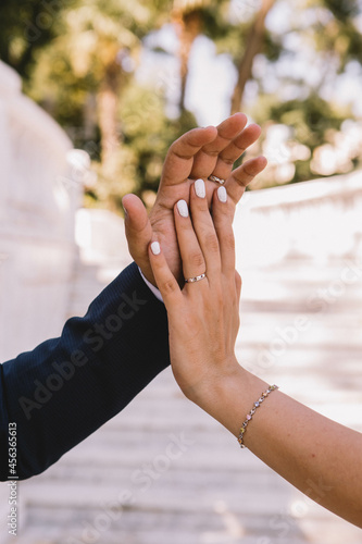 The image of a bride and groom holding hands on a wedding day. Hands, rings, wedding day. Wedding couple. Holding hands