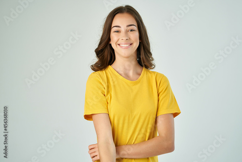 pretty brunette in yellow t-shirt smile posing lifestyle