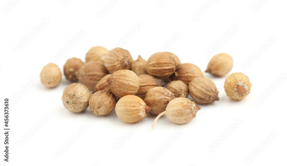 Heap of dried coriander seeds on white background Heap of dried coriander seeds on white background