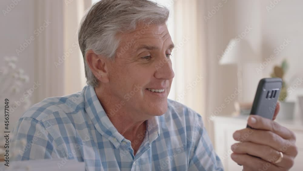 happy mature man having video chat using smartphone grandfather enjoying conversation with family sharing lifestyle chatting on mobile phone relaxing at home 4k happy mature man having video chat using smartphone grandfather enjoying conversation with family sharing lifestyle chatting on mobile phone relaxing at home 4k