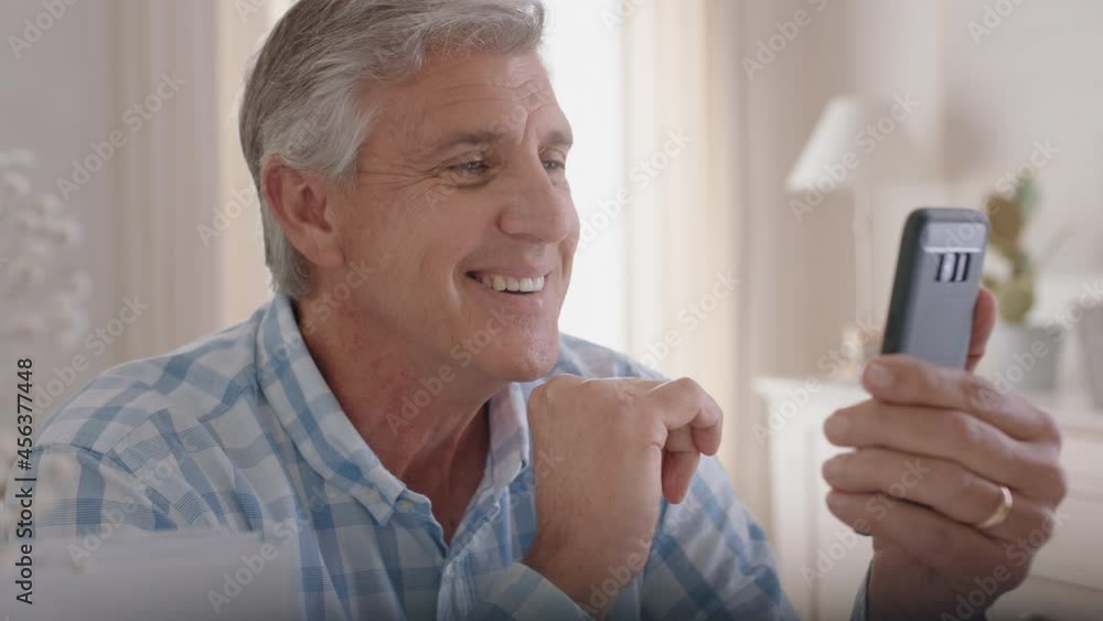 happy mature man having video chat using smartphone grandfather waving at baby enjoying chatting to grandchild on mobile phone 4k footage happy mature man having video chat using smartphone grandfather waving at baby enjoying chatting to grandchild on mobile phone 4k footage