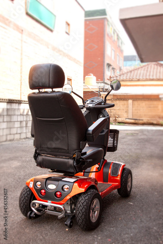 The electric wheelchair that's stopped without anyone riding. photo