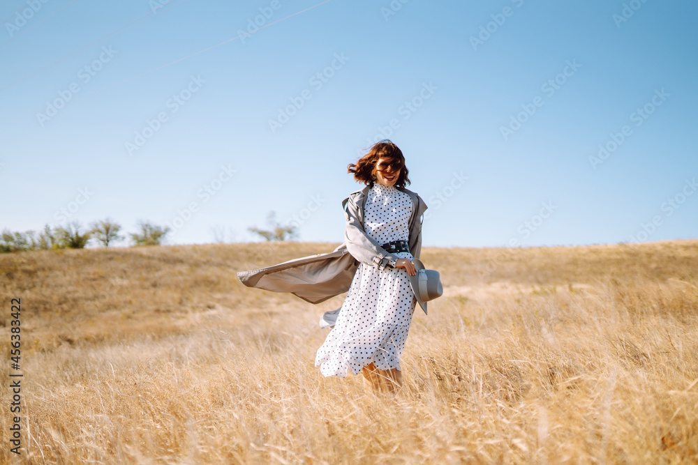 Young woman in stylish clothes posing in nature. Autumn style. Travel and adventure. Young woman in stylish clothes posing in nature. Autumn style. Travel and adventure.