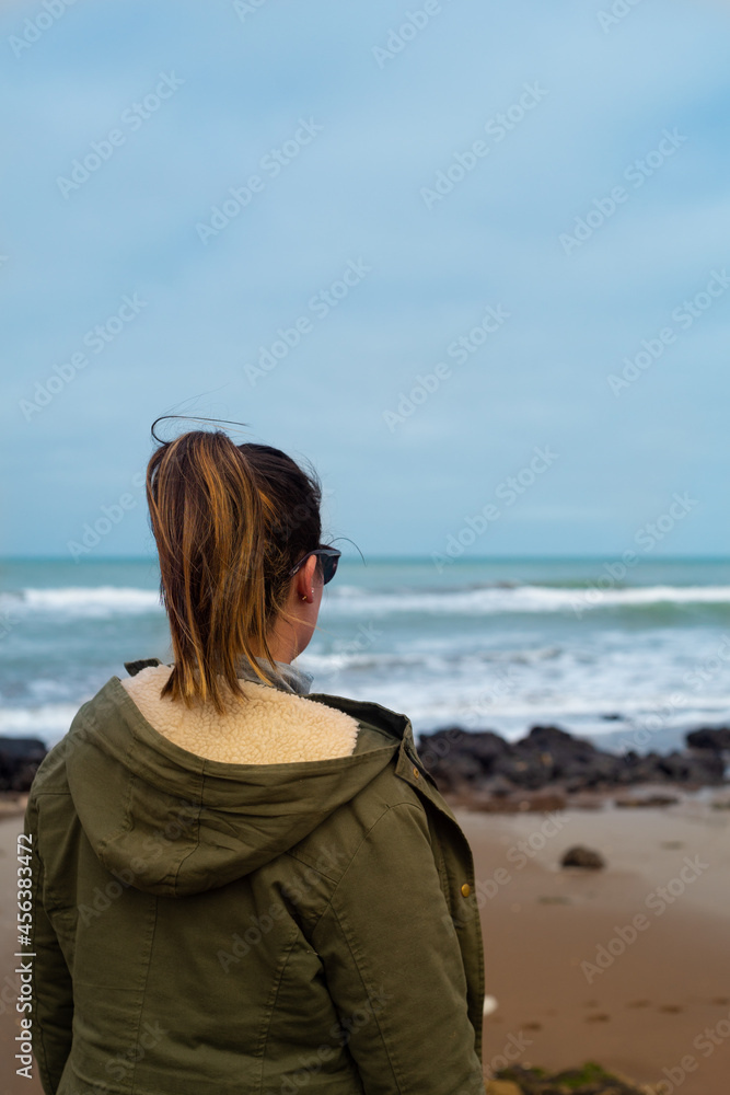 a girl enjoys on the beach in front of the sea while pointing and opening her arms for a healthy life full of peace and freedom
a girl enjoys on the beach in front of the sea while pointing and opening her arms for a healthy life full of peace and freedom