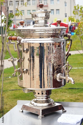 A metal device for boiling water with a firebox inside filled with coals. Samovar photo