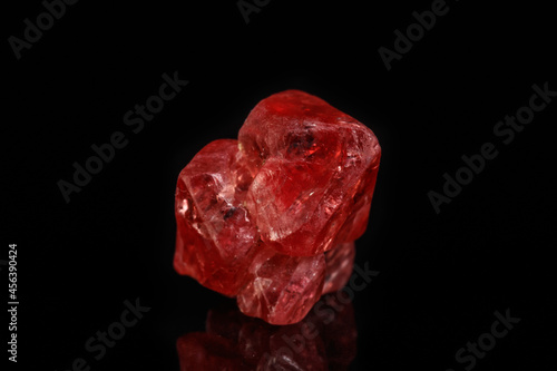 Macro mineral spinel stone on black background