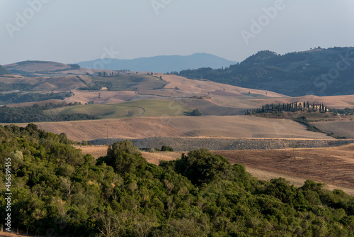 The landscapes of Tuscany with their typical architecture, agricultural use and widespread hills.