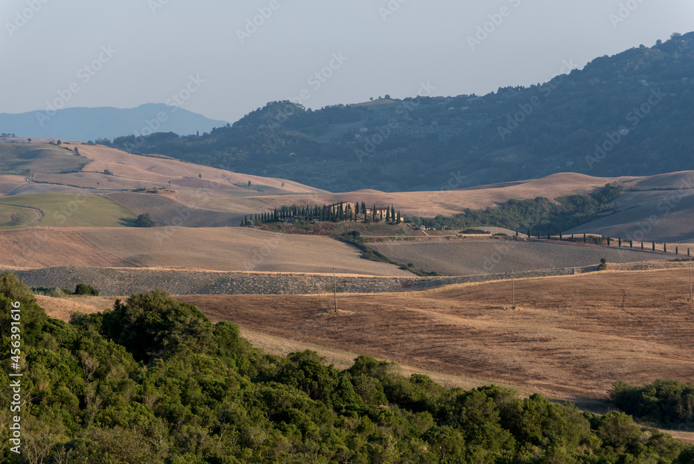 The landscapes of Tuscany with their typical architecture, agricultural use and widespread hills.