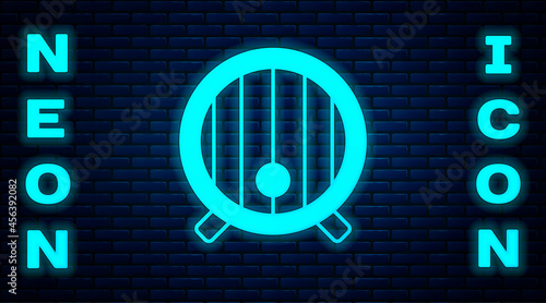 Glowing neon Wooden barrel icon isolated on brick wall background. Alcohol barrel, drink container, wooden keg for beer, whiskey, wine. Vector