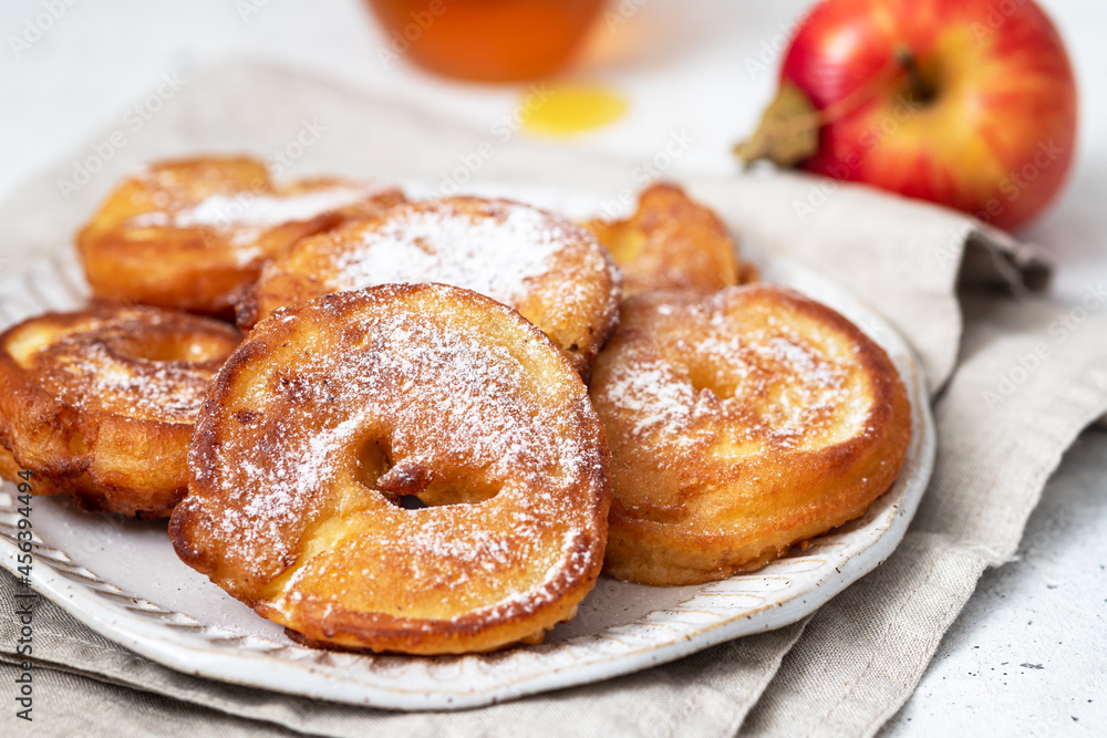 Apple pancakes with cinnamon and powdered sugar Apple pancakes with cinnamon and powdered sugar